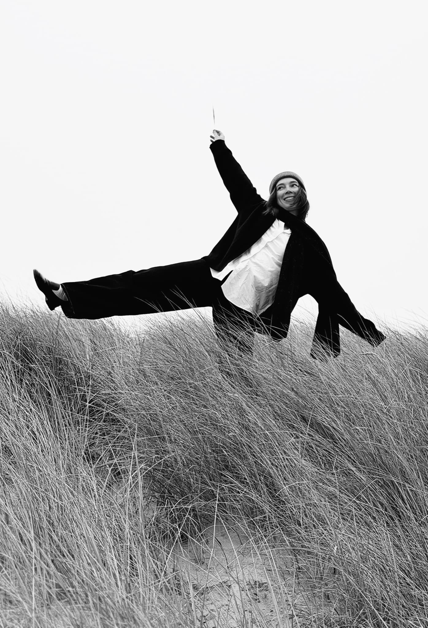 Regina Shigapova sitting in the dunes